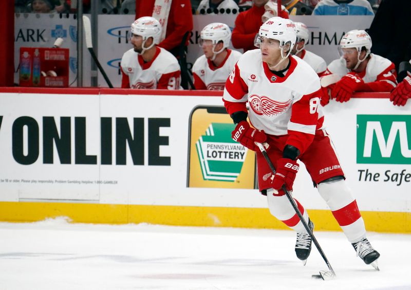 Mar 17, 2024; Pittsburgh, Pennsylvania, USA;  Detroit Red Wings right wing Patrick Kane (88) moves the puck against the Pittsburgh Penguins during the first period at PPG Paints Arena. Mandatory Credit: Charles LeClaire-USA TODAY Sports