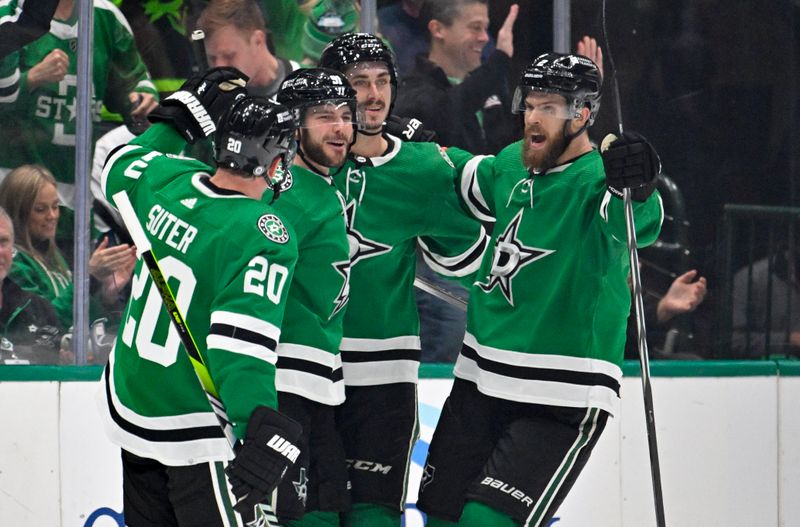 Nov 14, 2023; Dallas, Texas, USA; Dallas Stars defenseman Ryan Suter (20) and center Tyler Seguin (91) and left wing Mason Marchment (27) and defenseman Jani Hakanpaa (2) celebrate after Seguin scores the game tying goal against the Arizona Coyotes during the third period at the American Airlines Center. Mandatory Credit: Jerome Miron-USA TODAY Sports