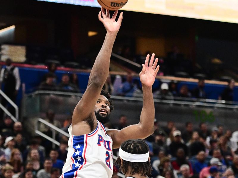 ORLANDO, FLORIDA - JANUARY 19: Joel Embiid #21 of the Philadelphia 76ers shoots the ball against Wendell Carter Jr. #34 of the Orlando Magic in the first half of a game at Kia Center on January 19, 2024 in Orlando, Florida. NOTE TO USER: User expressly acknowledges and agrees that, by downloading and or using this photograph, User is consenting to the terms and conditions of the Getty Images License Agreement. (Photo by Julio Aguilar/Getty Images)