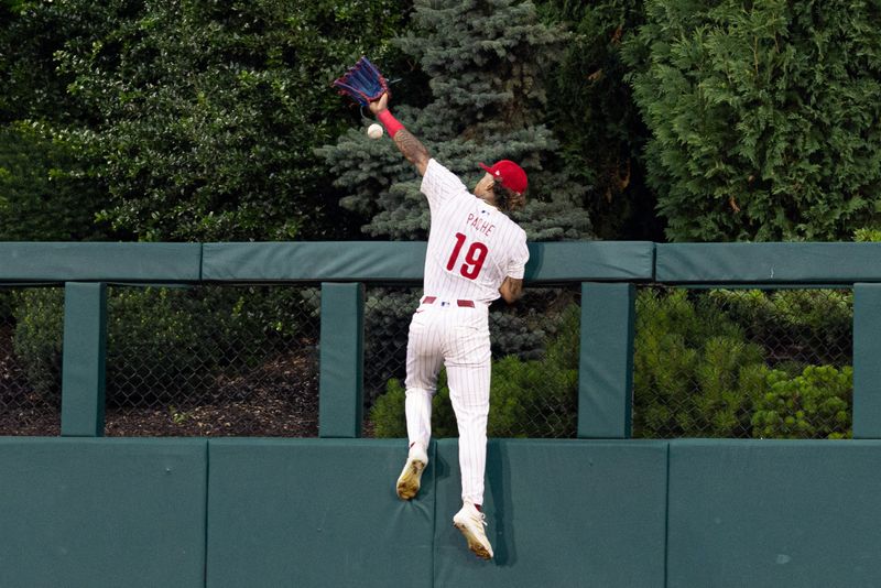 Jun 18, 2024; Philadelphia, Pennsylvania, USA; Philadelphia Phillies outfielder Cristian Pache (19) is unable to catch the home run of San Diego Padres catcher Luis Campusano (not pictured) during the sixth inning at Citizens Bank Park. Mandatory Credit: Bill Streicher-USA TODAY Sports