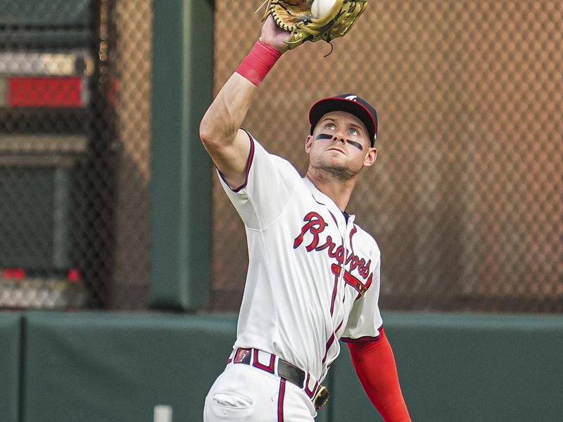 Jun 17, 2024; Cumberland, Georgia, USA; Atlanta Braves center fielder Jarred Kelenic (24) catches a ball hit by Detroit Tigers third baseman Gio Urshela (13) (not shown) during the second inning at Truist Park. Mandatory Credit: Dale Zanine-USA TODAY Sports