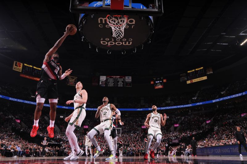 PORTLAND, OR - MARCH 11: Scoot Henderson #00 of the Portland Trail Blazers drives to the basket during the game against the Boston Celtics on March 11, 2024 at the Moda Center Arena in Portland, Oregon. NOTE TO USER: User expressly acknowledges and agrees that, by downloading and or using this photograph, user is consenting to the terms and conditions of the Getty Images License Agreement. Mandatory Copyright Notice: Copyright 2024 NBAE (Photo by Cameron Browne/NBAE via Getty Images)