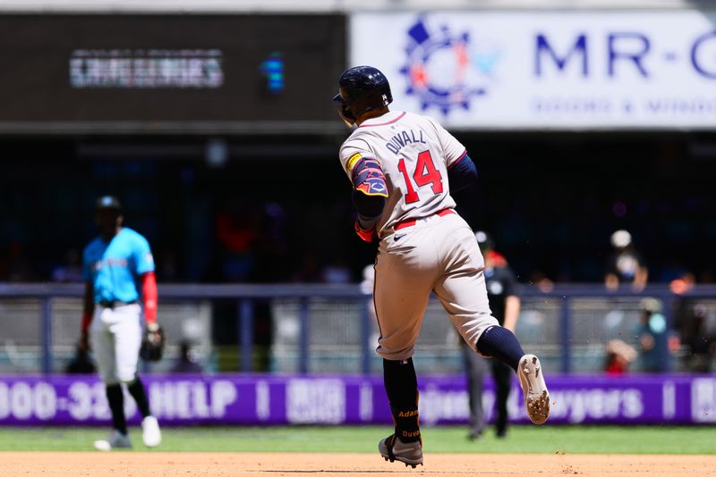 Apr 14, 2024; Miami, Florida, USA; Atlanta Braves left fielder Adam Duvall (14) circles the bases after hitting a home run against the Miami Marlins during the fourth inning at loanDepot Park. Mandatory Credit: Sam Navarro-USA TODAY Sports