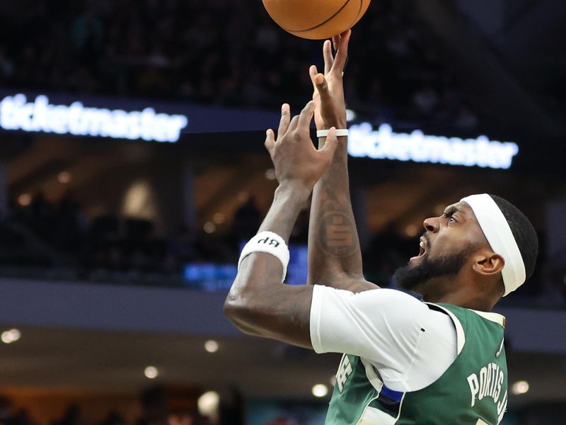 MILWAUKEE, WISCONSIN - FEBRUARY 09: Bobby Portis #9 of the Milwaukee Bucks shoots over Miles Bridges #0 of the Charlotte Hornets during a game against the Charlotte Hornets at Fiserv Forum on February 09, 2024 in Milwaukee, Wisconsin. NOTE TO USER: User expressly acknowledges and agrees that, by downloading and or using this photograph, User is consenting to the terms and conditions of the Getty Images License Agreement. (Photo by Stacy Revere/Getty Images)