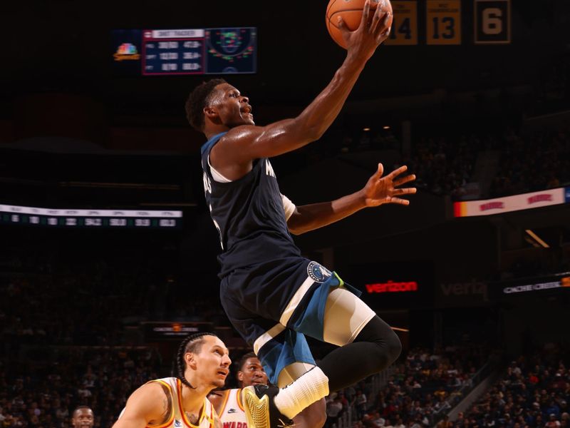 SAN FRANCISCO, CA - DECEMBER 8: Anthony Edwards #5 of the Minnesota Timberwolves drives to the basket during the game against the Golden State Warriors on October 22, 2024 at Chase Center in San Francisco, California. NOTE TO USER: User expressly acknowledges and agrees that, by downloading and or using this photograph, user is consenting to the terms and conditions of Getty Images License Agreement. Mandatory Copyright Notice: Copyright 2024 NBAE (Photo by Jed Jacobsohn/NBAE via Getty Images)