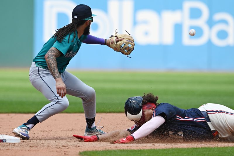 Jun 20, 2024; Cleveland, Ohio, USA; Cleveland Guardians first baseman Josh Naylor (22) slides into second with an RBI double as Seattle Mariners shortstop J.P. Crawford (3) waits for the throw during the fifth inning at Progressive Field. Mandatory Credit: Ken Blaze-USA TODAY Sports