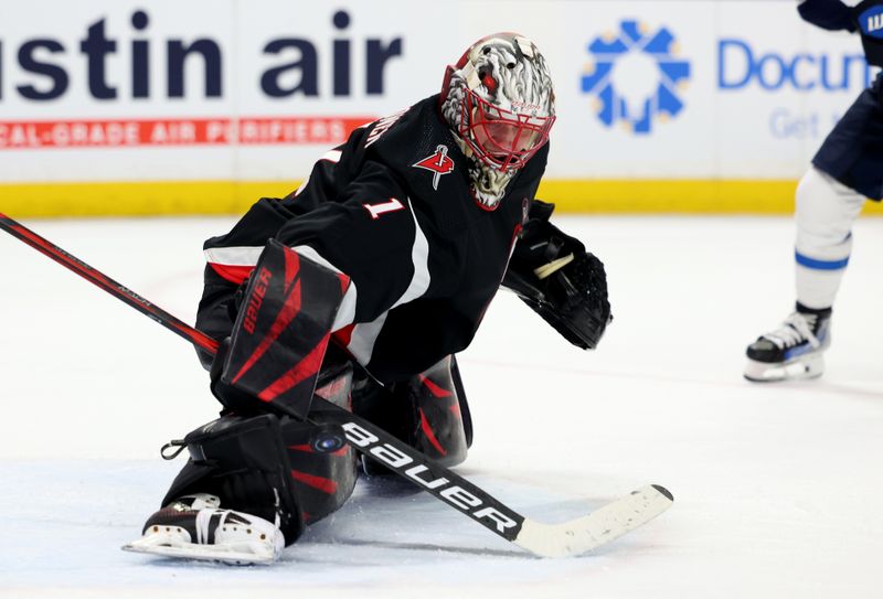 Mar 3, 2024; Buffalo, New York, USA;  Buffalo Sabres goaltender Ukko-Pekka Luukkonen (1) makes a pad save during the third period against the Winnipeg Jets at KeyBank Center. Mandatory Credit: Timothy T. Ludwig-USA TODAY Sports