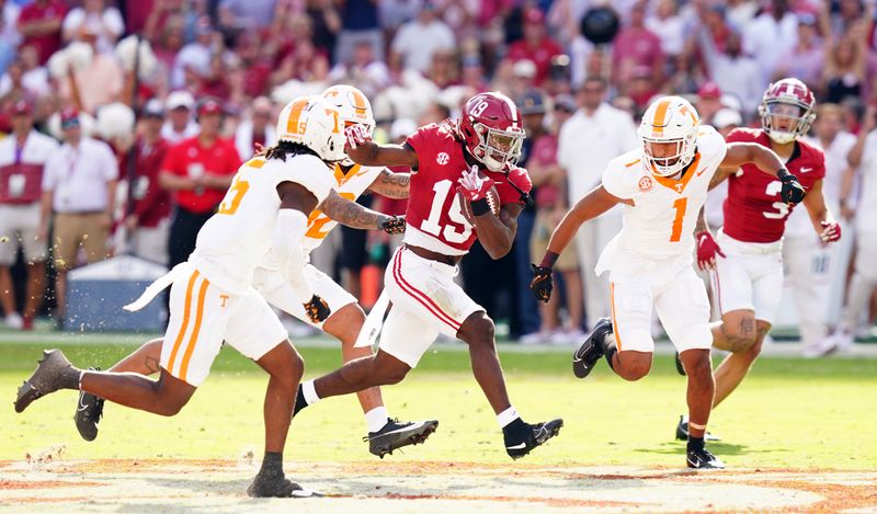 Oct 21, 2023; Tuscaloosa, Alabama, USA; Alabama Crimson Tide wide receiver Kendrick Law (19) carries the ball against the Tennessee Volunteers during the first half at Bryant-Denny Stadium. Mandatory Credit: John David Mercer-USA TODAY Sports