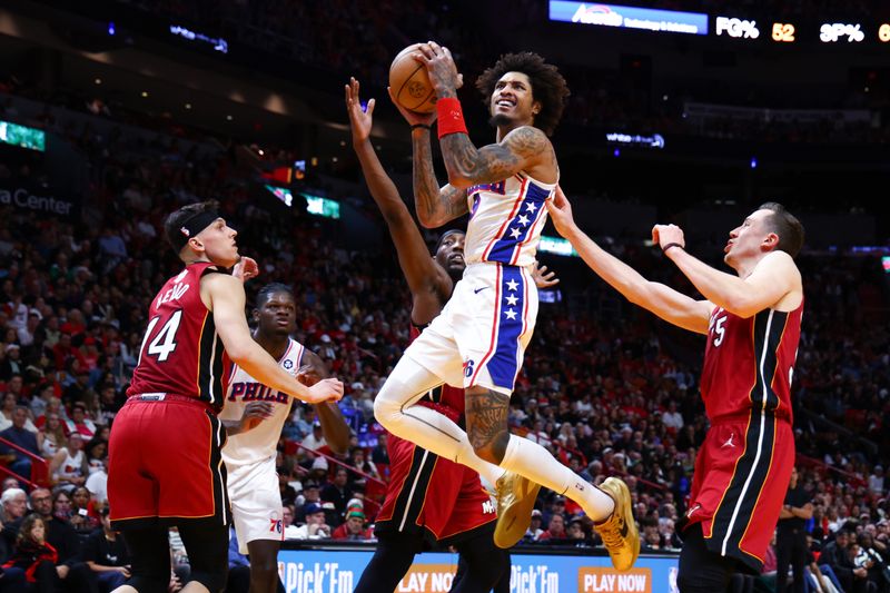 MIAMI, FLORIDA - DECEMBER 25: Kelly Oubre Jr. #9 of the Philadelphia 76ers drives to the basket against the Miami Heat during the second quarter of the game at Kaseya Center on December 25, 2023 in Miami, Florida. NOTE TO USER: User expressly acknowledges and agrees that, by downloading and or using this photograph, User is consenting to the terms and conditions of the Getty Images License Agreement. (Photo by Megan Briggs/Getty Images)