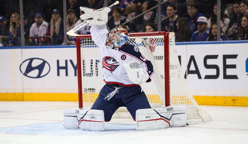 Jan 18, 2025; New York, New York, USA; Columbus Blue Jackets goalie Daniil Tarasov (40) deflects a puck over the net during the first period against the New York Rangers at Madison Square Garden. Mandatory Credit: Danny Wild-Imagn Images