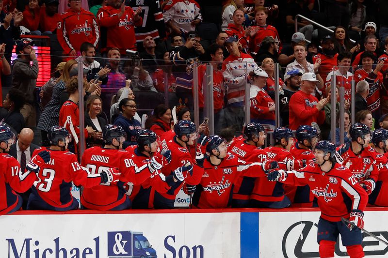 Oct 31, 2024; Washington, District of Columbia, USA; Washington Capitals right wing Brandon Duhaime (22) celebrates with teammates after scoring a goal against the Montreal Canadiens in the second period at Capital One Arena. Mandatory Credit: Geoff Burke-Imagn Images