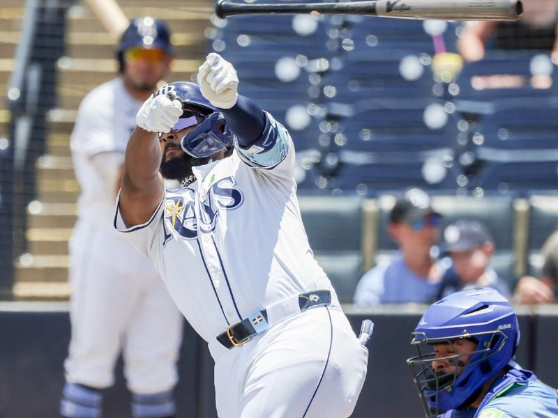 May 25, 2025; St. Petersburg, Florida, USA;  Tampa Bay Rays third base Junior Caminero (13) throws his bat while at bat against the Toronto Blue Jays during the first inning at George M. Steinbrenner Field. Mandatory Credit: Kim Klement Neitzel-Imagn Images