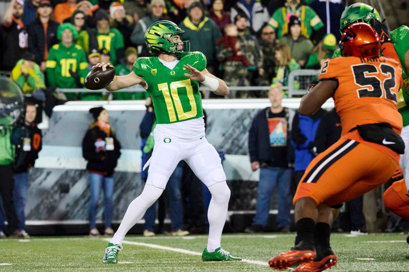 Nov 24, 2023; Eugene, Oregon, USA; Oregon Ducks quarterback Bo Nix (10) throws a pass during the first half against the Oregon State Beavers at Autzen Stadium. Mandatory Credit: Troy Wayrynen-USA TODAY Sports