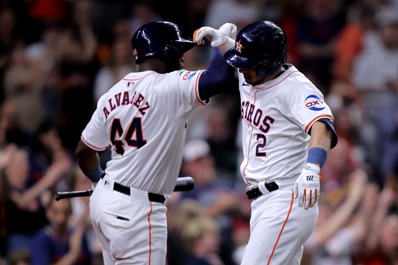 Apr 30, 2024; Houston, Texas, USA; Houston Astros third baseman Alex Bregman (2) celebrates with Houston Astros designated hitter Yordan Alvarez (44) after hitting a three-run home run to left field against the Cleveland Guardians during the third inning at Minute Maid Park. Mandatory Credit: Erik Williams-USA TODAY Sports