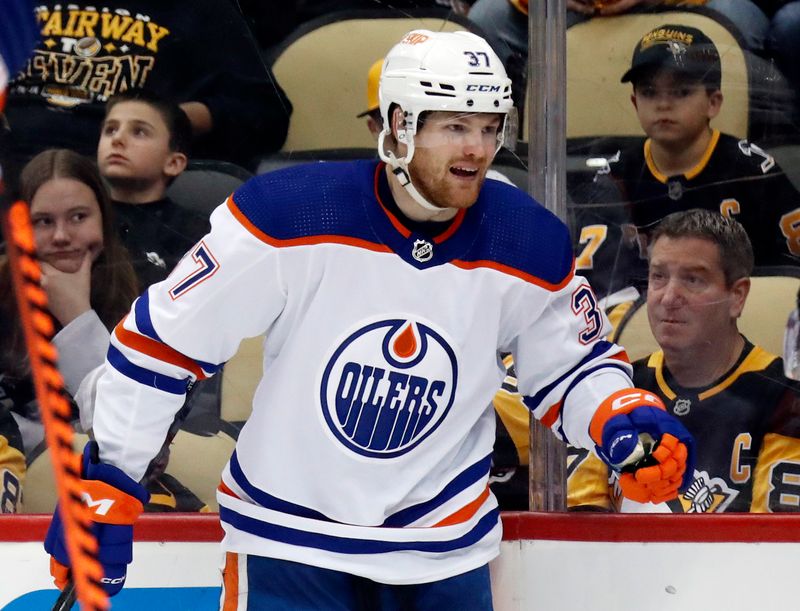 Feb 23, 2023; Pittsburgh, Pennsylvania, USA;  Edmonton Oilers left wing Warren Foegele (37) reacts after scoring a goal against the Pittsburgh Penguins during the second period at PPG Paints Arena. Edmonton won 7-2. Mandatory Credit: Charles LeClaire-USA TODAY Sports