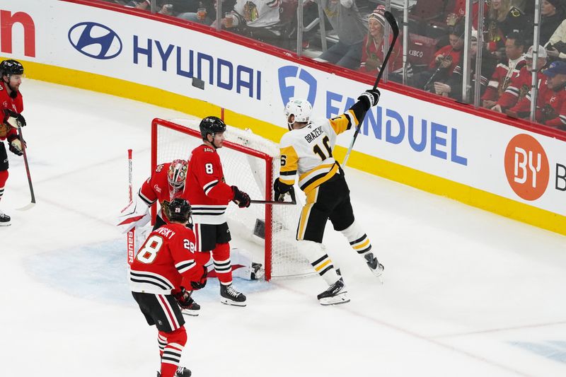 Dec 28, 2025; Chicago, Illinois, USA; Pittsburgh Penguins right wing Justin Brazeau (16) celebrates scoring a goal against Chicago Blackhawks goaltender Spencer Knight (30) during the first period at United Center. Mandatory Credit: David Banks-Imagn Images