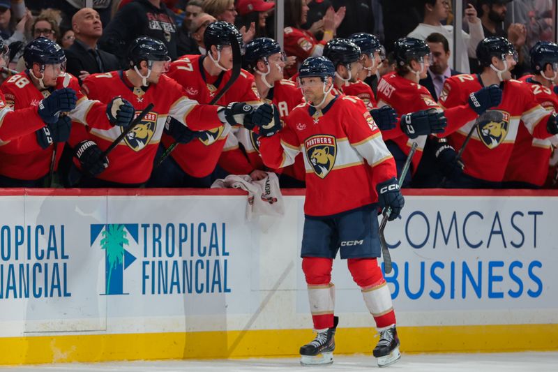 Nov 27, 2024; Sunrise, Florida, USA; Florida Panthers center Sam Reinhart (13) celebrates with teammates after scoring against the Toronto Maple Leafs during the second period at Amerant Bank Arena. Mandatory Credit: Sam Navarro-Imagn Images