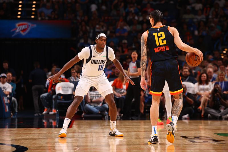 OKLAHOMA CITY, OK - APRIL 14:  Olivier Maxence-Prosper #18 of the Dallas Mavericks plays defense during the game against the Oklahoma City Thunder on April 14, 2024 at Paycom Arena in Oklahoma City, Oklahoma. NOTE TO USER: User expressly acknowledges and agrees that, by downloading and or using this photograph, User is consenting to the terms and conditions of the Getty Images License Agreement. Mandatory Copyright Notice: Copyright 2024 NBAE (Photo by Zach Beeker/NBAE via Getty Images)