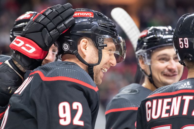 Mar 17, 2024; Ottawa, Ontario, CAN; The Carolina Hurricanes celebrate a goal scored by center Evgeny Kuznetsov (92) in the second period against the Ottawa Senators at the Canadian Tire Centre. Mandatory Credit: Marc DesRosiers-USA TODAY Sports