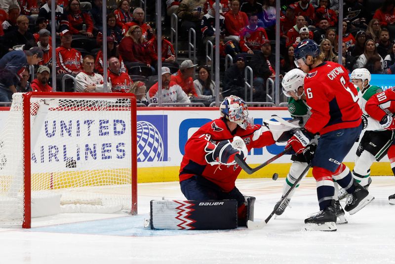 Oct 17, 2024; Washington, District of Columbia, USA; Washington Capitals goaltender Charlie Lindgren (79) makes a save on Dallas Stars center Wyatt Johnston (53) as Capitals defenseman Jakob Chychrun (6) defends in the second period at Capital One Arena. Mandatory Credit: Geoff Burke-Imagn Images