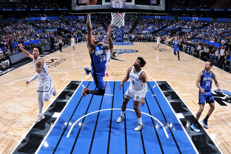 ORLANDO, FL - FEBRUARY 27: Markelle Fultz #20 of the Orlando Magic drives to the basket during the game against the Brooklyn Nets on February 27, 2024 at the Kia Center in Orlando, Florida. NOTE TO USER: User expressly acknowledges and agrees that, by downloading and or using this photograph, User is consenting to the terms and conditions of the Getty Images License Agreement. Mandatory Copyright Notice: Copyright 2024 NBAE (Photo by Fernando Medina/NBAE via Getty Images)