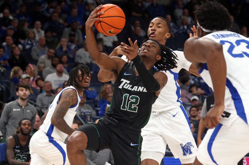 Feb 11, 2024; Memphis, Tennessee, USA; Tulane Green Wave guard Kolby King (12) drives to the basket during the second half against the Memphis Tigers at FedExForum. Mandatory Credit: Petre Thomas-USA TODAY Sports