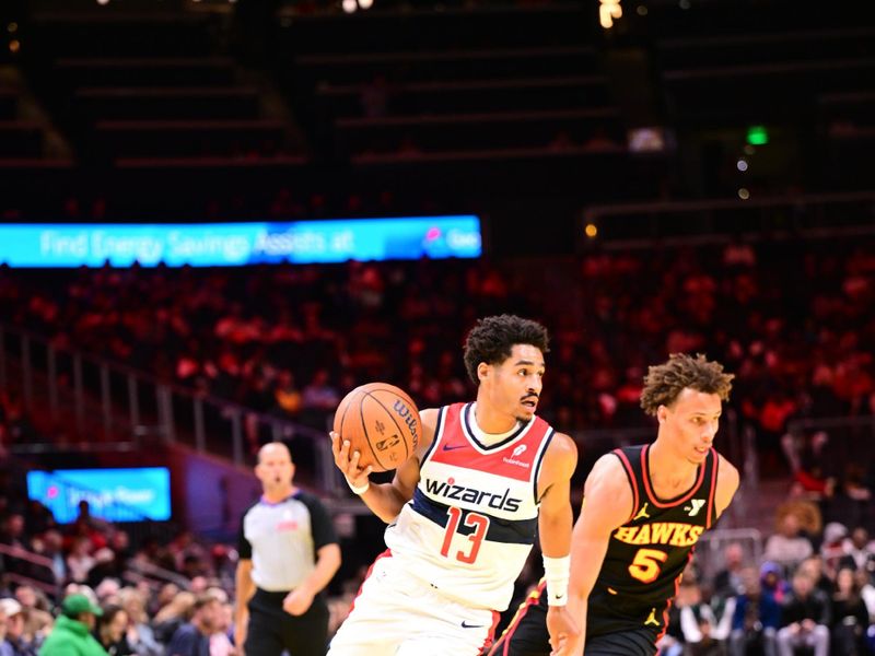 ATLANTA, GA - NOVEMBER 15:  Jordan Poole #13 of the Washington Wizardsdribbles the ball during the game against the Atlanta Hawks during the Emirates NBA Cup game on November 15, 2024 at State Farm Arena in Atlanta, Georgia.  NOTE TO USER: User expressly acknowledges and agrees that, by downloading and/or using this Photograph, user is consenting to the terms and conditions of the Getty Images License Agreement. Mandatory Copyright Notice: Copyright 2024 NBAE (Photo by Adam Hagy/NBAE via Getty Images)