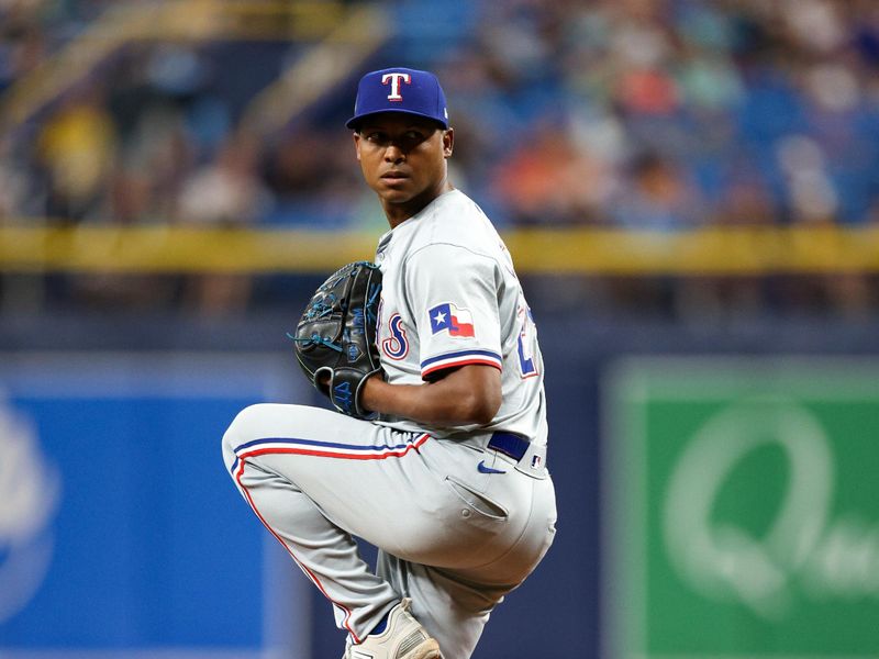 Apr 3, 2024; St. Petersburg, Florida, USA;  Texas Rangers relief pitcher Jose Leclerc (25) throws a pitch against the Tampa Bay Rays in the ninth inning at Tropicana Field. Mandatory Credit: Nathan Ray Seebeck-USA TODAY Sports