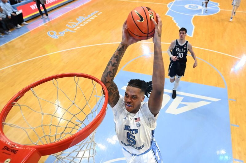 Feb 3, 2024; Chapel Hill, North Carolina, USA; North Carolina Tar Heels forward Armando Bacot (5) scores in the second half at Dean E. Smith Center. Mandatory Credit: Bob Donnan-USA TODAY Sports