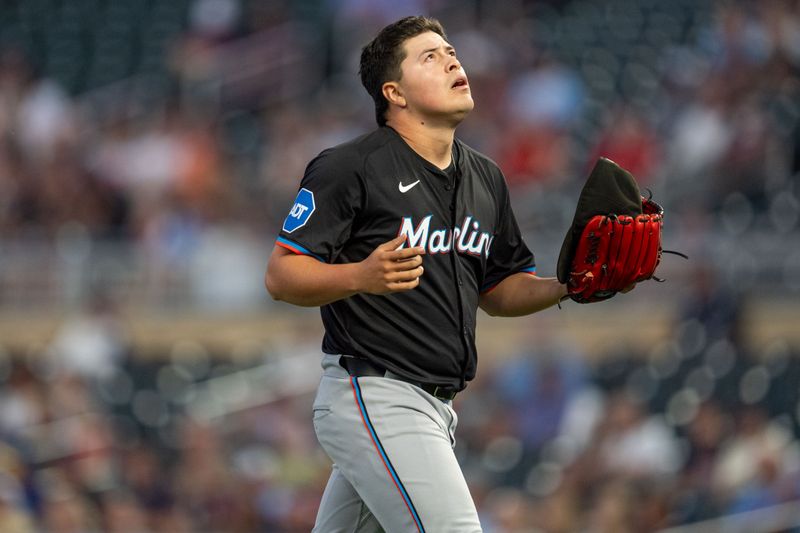 Sep 26, 2024; Minneapolis, Minnesota, USA; Miami Marlins pitcher Valente Bellozo (83) exits the field after a double play that ended the first inning against the Minnesota Twins at Target Field. Mandatory Credit: Matt Blewett-Imagn Images