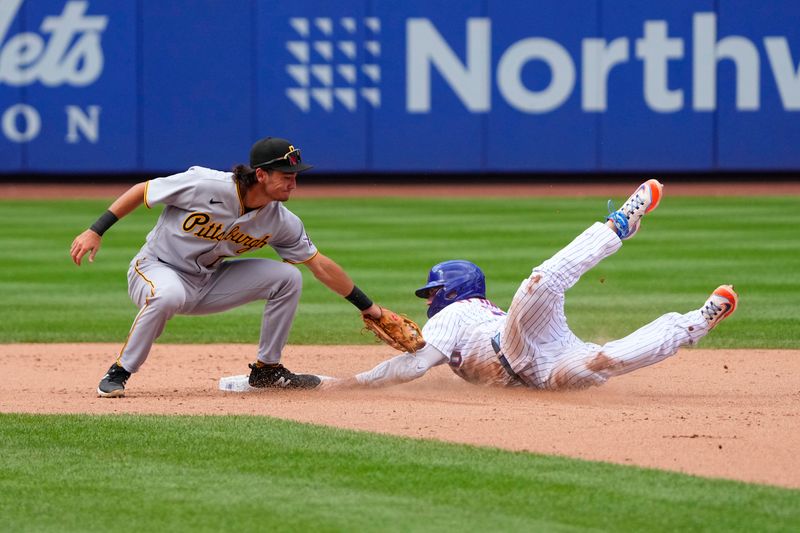 Aug 16, 2023; New York City, New York, USA; Pittsburgh Pirates shortstop Alika Williams (75) tags out New York Mets first baseman Pete Alonso (20) attempting to steal second base during the fifth inning at Citi Field. Mandatory Credit: Gregory Fisher-USA TODAY Sports