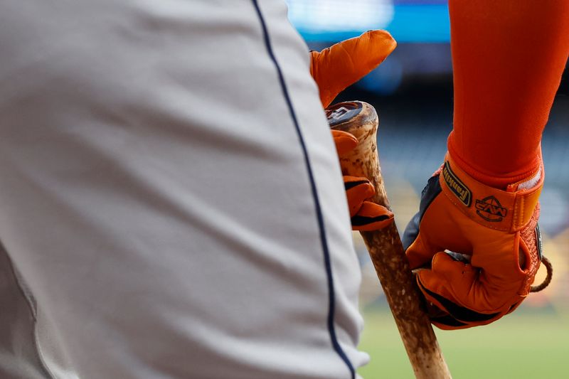 Apr 19, 2024; Washington, District of Columbia, USA; Houston Astros second base Jose Altuve (27) applies stick-em to the handle of his bat in the on deck circle against the Washington Nationals during the first inning at Nationals Park. Mandatory Credit: Geoff Burke-USA TODAY Sports