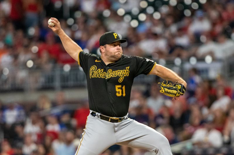 Sep 9, 2023; Cumberland, Georgia, USA; Pittsburgh Pirates relief pitcher David Bednar (51) pitches against Atlanta Braves during ninth inning at Truist Park. Mandatory Credit: Jordan Godfree-USA TODAY Sports