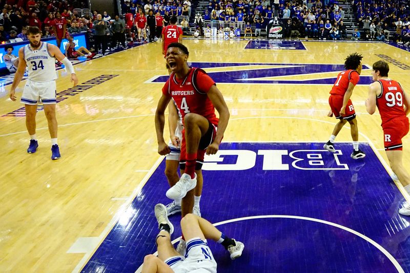 Jan 29, 2025; Evanston, Illinois, USA; Rutgers Scarlet Knights guard Ace Bailey (4) reacts after dunking the ball against the Northwestern Wildcats during the first half at Welsh-Ryan Arena. Mandatory Credit: David Banks-Imagn Images