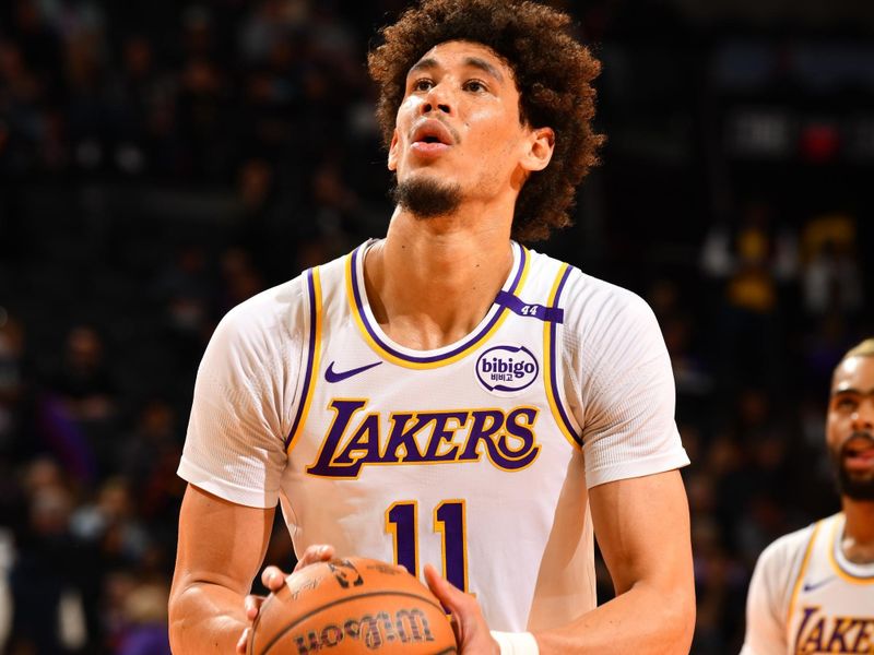 PHOENIX, AZ - NOVEMBER 26: Jaxson Hayes #11 of the Los Angeles Lakers shoots a free throw during the game against the Phoenix Suns during the Emirates NBA Cup game on November 26, 2024 at Footprint Center in Phoenix, Arizona. NOTE TO USER: User expressly acknowledges and agrees that, by downloading and or using this photograph, user is consenting to the terms and conditions of the Getty Images License Agreement. Mandatory Copyright Notice: Copyright 2024 NBAE (Photo by Barry Gossage/NBAE via Getty Images)