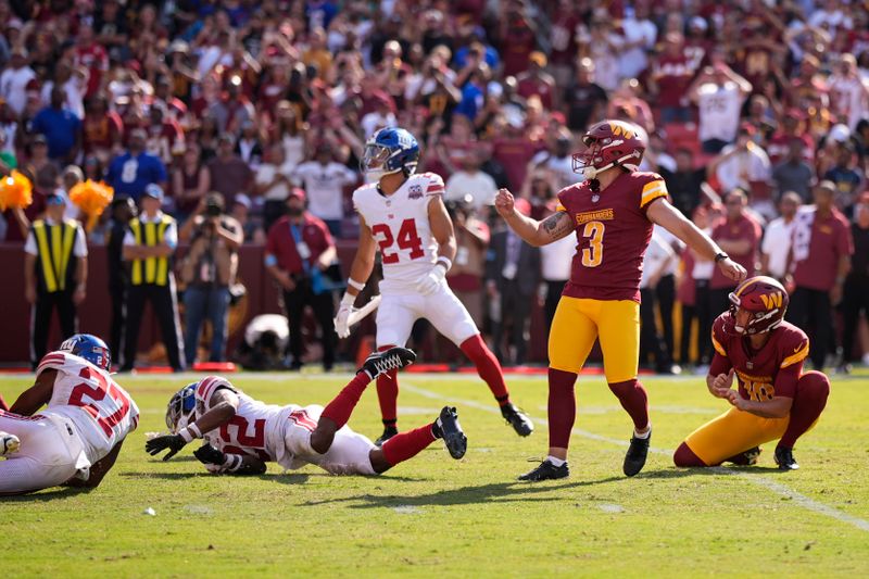 Washington Commanders place kicker Austin Seibert (3) watches his game-winning field goal against the New York Giants during the second half of an NFL football game in Landover, Md., Sunday, Sept. 15, 2024. (AP Photo/Matt Slocum)