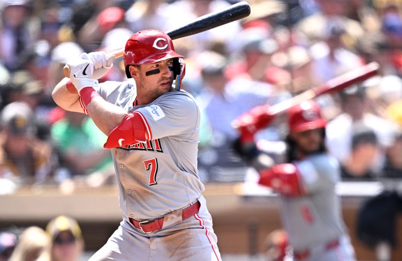 May 1, 2024; San Diego, California, USA; Cincinnati Reds left fielder Spencer Steer (7) bats as second baseman Jonathan India (right) awaits win the on-deck circle during the sixth inning against the San Diego Padres at Petco Park. Mandatory Credit: Orlando Ramirez-USA TODAY Sports