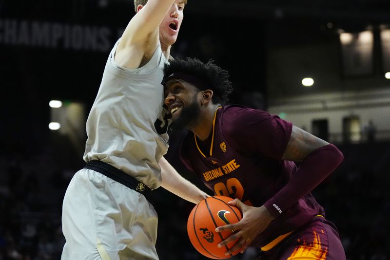 Dec 1, 2022; Boulder, Colorado, USA; Arizona State Sun Devils forward Warren Washington (22) collides into Colorado Buffaloes guard Jalen Gabbidon (3) in the second half at the CU Events Center. Mandatory Credit: Ron Chenoy-USA TODAY Sports