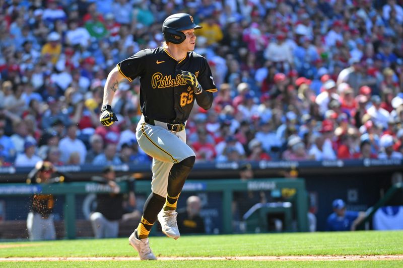 Apr 14, 2024; Philadelphia, Pennsylvania, USA; Pittsburgh Pirates outfielder Jack Suwinski (65) watches his grand slam home run against the Philadelphia Phillies during the sixth inning at Citizens Bank Park. Mandatory Credit: Eric Hartline-USA TODAY Sports