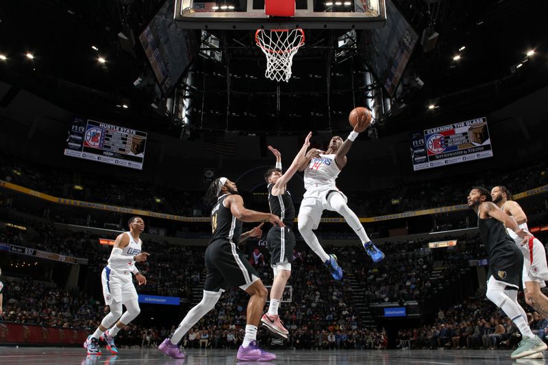 MEMPHIS, TN - FEBRUARY 23: Terance Mann #14 of the LA Clippers drives to the basket during the game against the Memphis Grizzlies on February 23, 2024 at FedExForum in Memphis, Tennessee. NOTE TO USER: User expressly acknowledges and agrees that, by downloading and or using this photograph, User is consenting to the terms and conditions of the Getty Images License Agreement. Mandatory Copyright Notice: Copyright 2024 NBAE (Photo by Joe Murphy/NBAE via Getty Images)