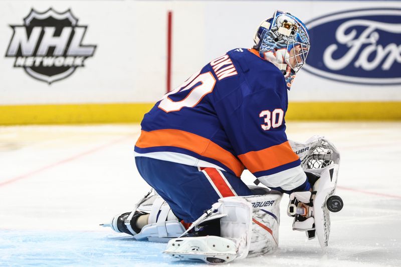 Oct 29, 2024; Elmont, New York, USA;  New York Islanders goaltender Ilya Sorokin (30) stops the puck in the first period against the Anaheim Ducks at UBS Arena. Mandatory Credit: Wendell Cruz-Imagn Images