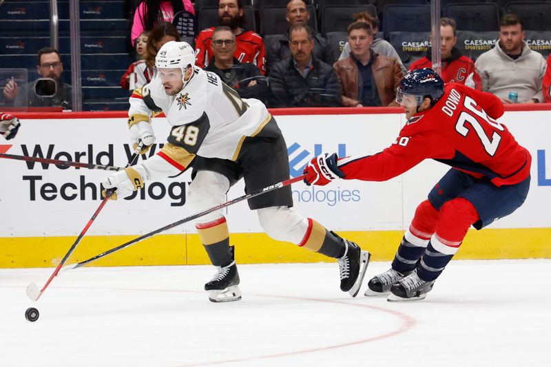 Oct 15, 2024; Washington, District of Columbia, USA; Vegas Golden Knights center Tomas Hertl (48) and Washington Capitals center Nic Dowd (26) battle for the puck in the first period at Capital One Arena. Mandatory Credit: Geoff Burke-Imagn Images