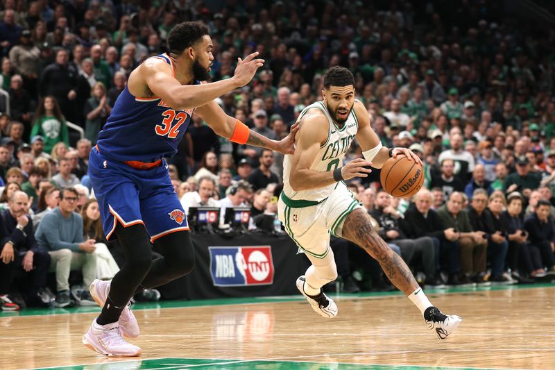 BOSTON, MASSACHUSETTS - MAY 05: Jayson Tatum #0 of the Boston Celtics drives the ball against Karl-Anthony Towns #32 of the New York Knicks during the fourth quarter in Game One of the Eastern Conference Second Round NBA Playoffs at TD Garden on May 05, 2025 in Boston, Massachusetts. NOTE TO USER: User expressly acknowledges and agrees that, by downloading and or using this photograph, User is consenting to the terms and conditions of the Getty Images License Agreement. (Photo by Maddie Meyer/Getty Images)