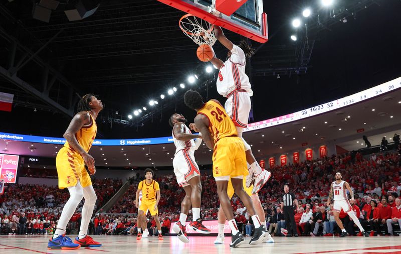 Feb 19, 2024; Houston, Texas, USA; Houston Cougars forward Ja'Vier Francis (5) dunks the ball during the second half against the Iowa State Cyclones at Fertitta Center. Mandatory Credit: Troy Taormina-USA TODAY Sports