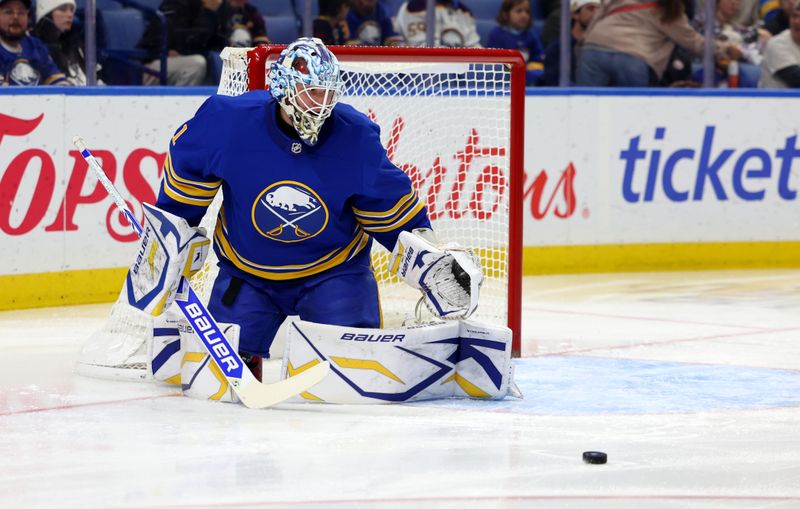 Nov 9, 2024; Buffalo, New York, USA;  Buffalo Sabres goaltender Ukko-Pekka Luukkonen (1) looks to make a save during the first period against the Calgary Flames at KeyBank Center. Mandatory Credit: Timothy T. Ludwig-Imagn Images