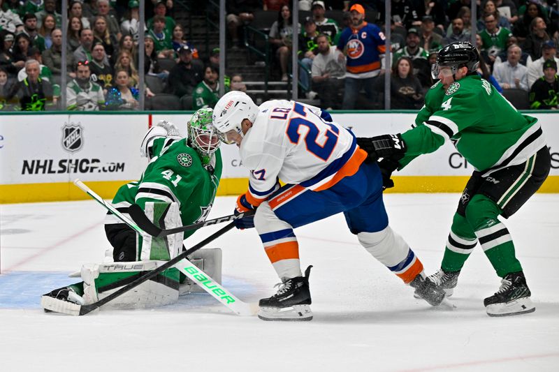 Feb 26, 2024; Dallas, Texas, USA; Dallas Stars goaltender Scott Wedgewood (41) stops a breakaway shot by New York Islanders left wing Anders Lee (27) as Stars defenseman Miro Heiskanen (4) is called for a penalty during the first period at the American Airlines Center. Mandatory Credit: Jerome Miron-USA TODAY Sports