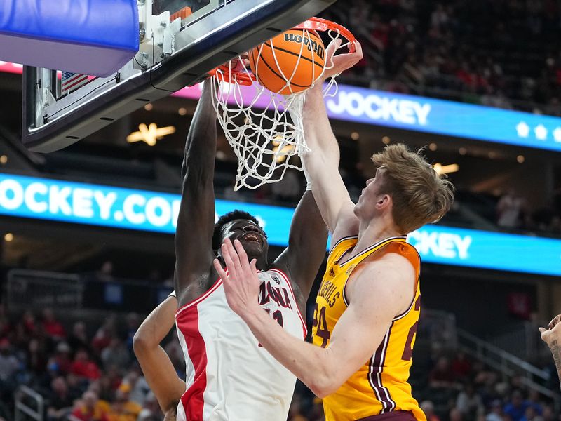 Mar 10, 2023; Las Vegas, NV, USA; Arizona Wildcats center Oumar Ballo (11) dunks against Arizona State Sun Devils forward Duke Brennan (24) during the second half at T-Mobile Arena. Mandatory Credit: Stephen R. Sylvanie-USA TODAY Sports