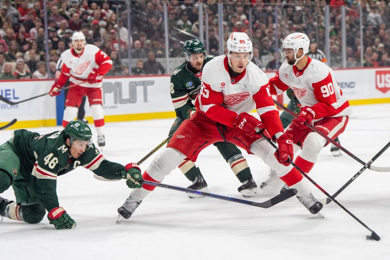Feb 25, 2025; Saint Paul, Minnesota, USA; Minnesota Wild defenseman Jared Spurgeon (46) stick checks Detroit Red Wings left wing Elmer Soderblom (85) in the first period at Xcel Energy Center. Mandatory Credit: Matt Blewett-Imagn Images