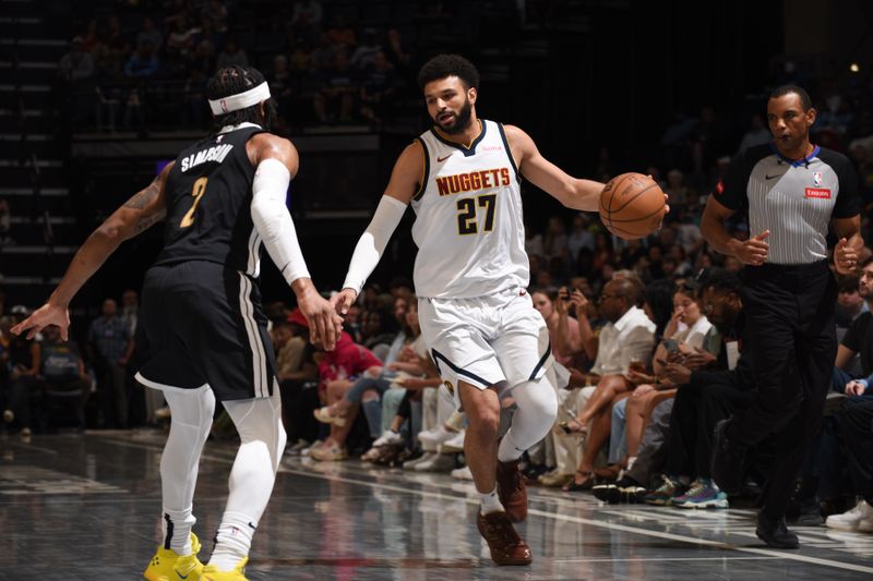 MEMPHIS, TN - APRIL 14:  Jamal Murray #27 of the Denver Nuggets handles the ball during the game against the Memphis Grizzlies on April 14, 2024 at FedExForum in Memphis, Tennessee. NOTE TO USER: User expressly acknowledges and agrees that, by downloading and or using this photograph, User is consenting to the terms and conditions of the Getty Images License Agreement. Mandatory Copyright Notice: Copyright 2024 NBAE (Photo by Grant Burke/NBAE via Getty Images)