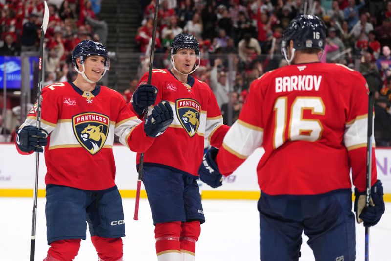 Nov 16, 2024; Sunrise, Florida, USA;  Florida Panthers center Aleksander Barkov (16) celebrates with defenseman Niko Mikkola (77) and defenseman Gustav Forsling (42) after scoring a short-handed goal against the Winnipeg Jets during the second period at Amerant Bank Arena. Mandatory Credit: Jim Rassol-Imagn Images